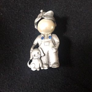 A child and dog pin.